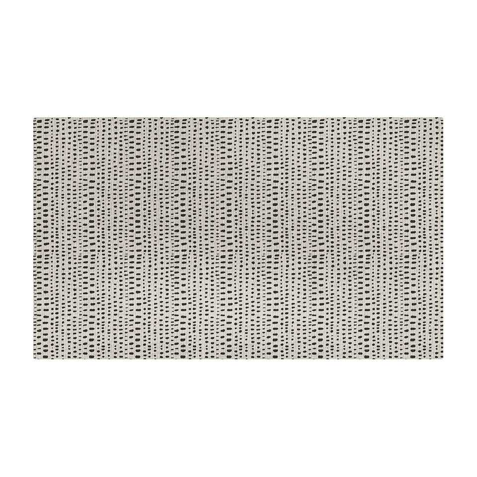 Overhead of Un-Rug's indigenous Dots mat with various sized, linear dots on a cream background.