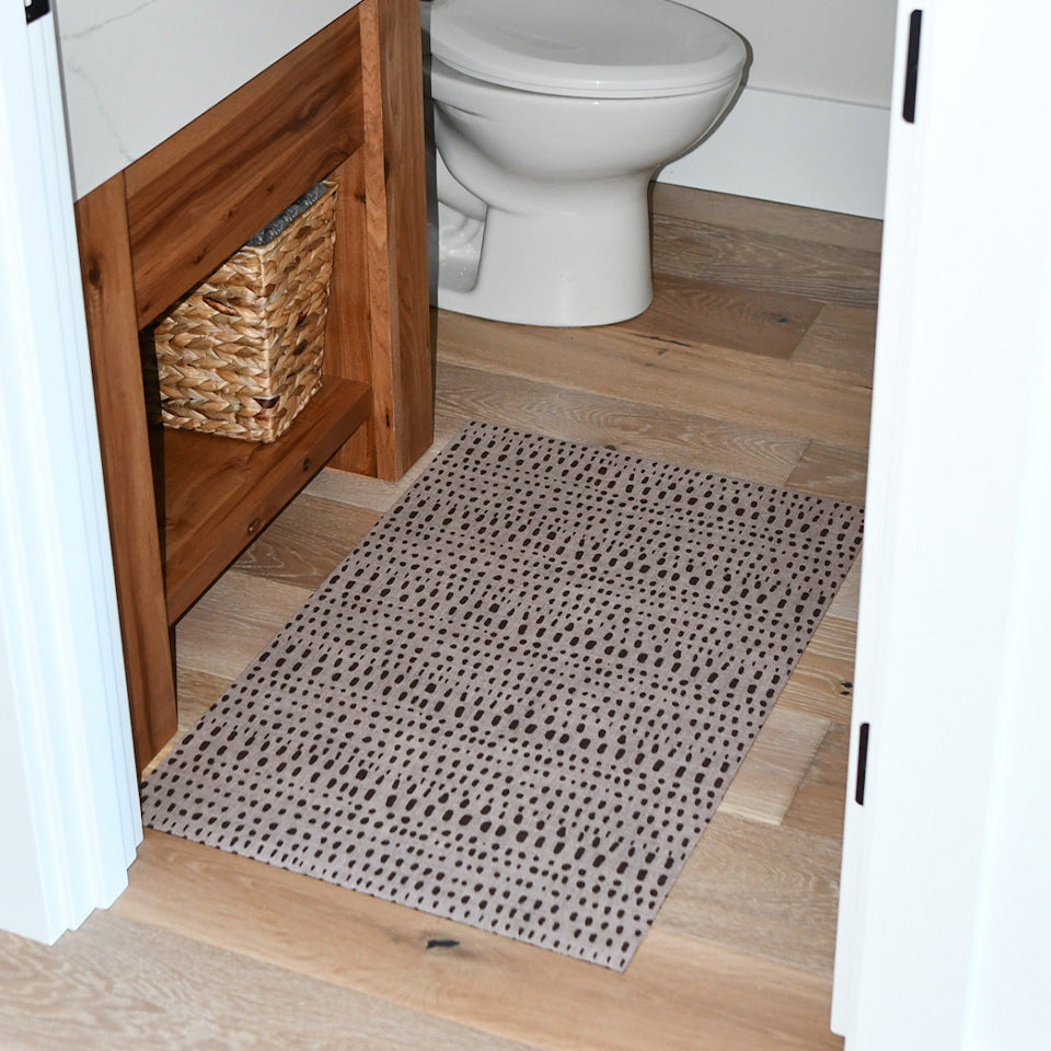 Small Indigenous Dots mat that works in the small bathroom for its low-profile and rubber back