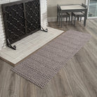 Stylish Indigenous Dots runner in front of a white brick fireplace