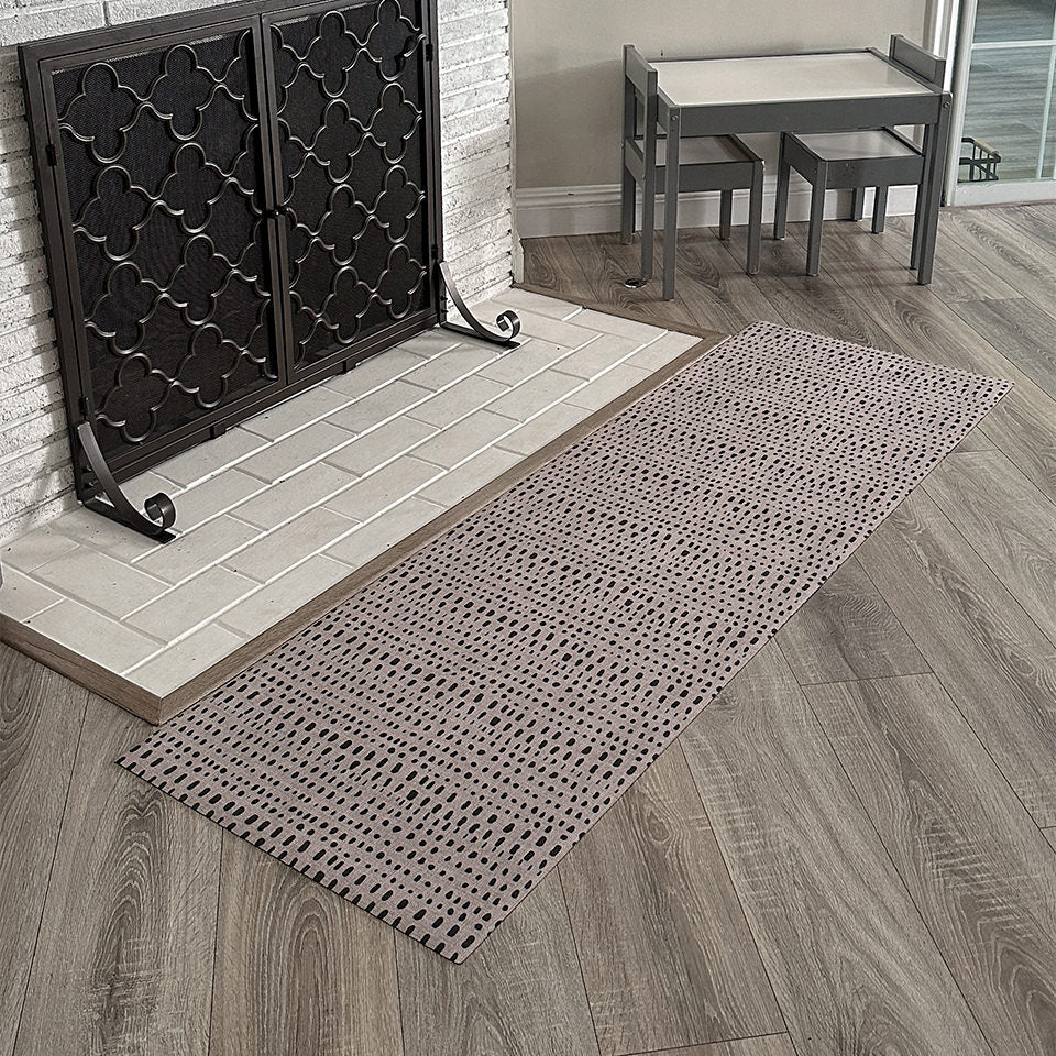 Stylish Indigenous Dots runner in front of a white brick fireplace