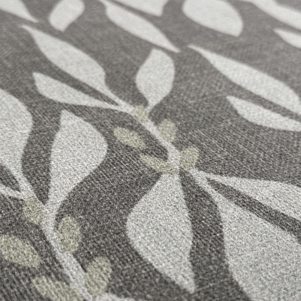 Close up of Leaf Motif soft, poly knitted surface with a cream leaf design on neutral brown background.