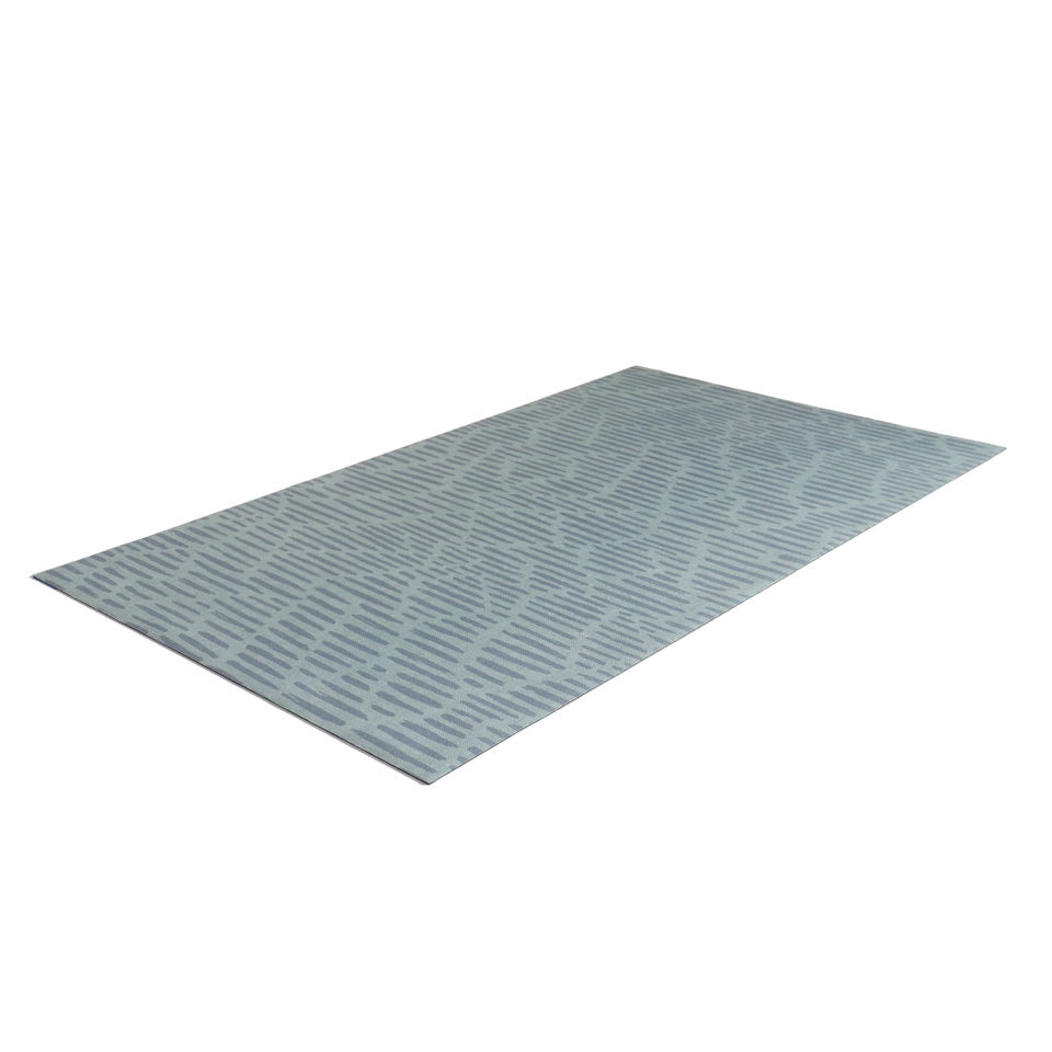 Overhead angled shot of Storm cloud grey blue organic line abstract design on sea salt blue background printed on a thin low profile machine washable floor mat for indoor use.