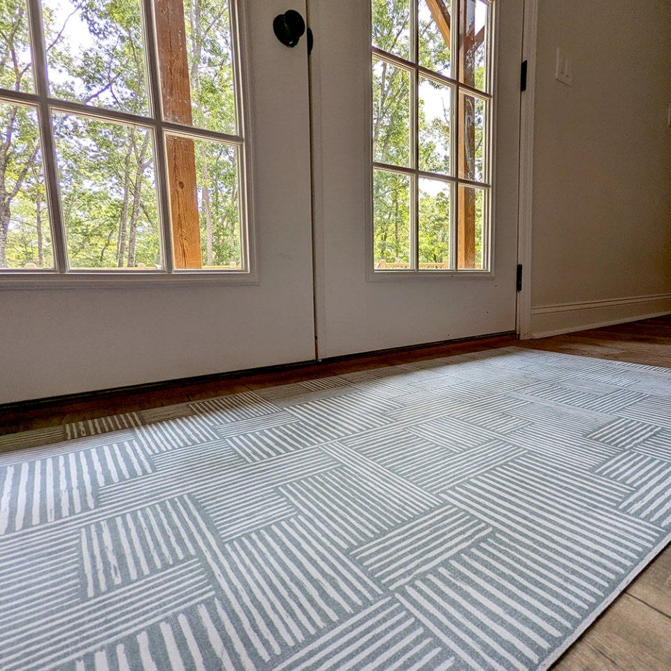 Sea Salt blue with snowbound cream colored organic lines in abstract square pattern low profile washable interior accent rug.