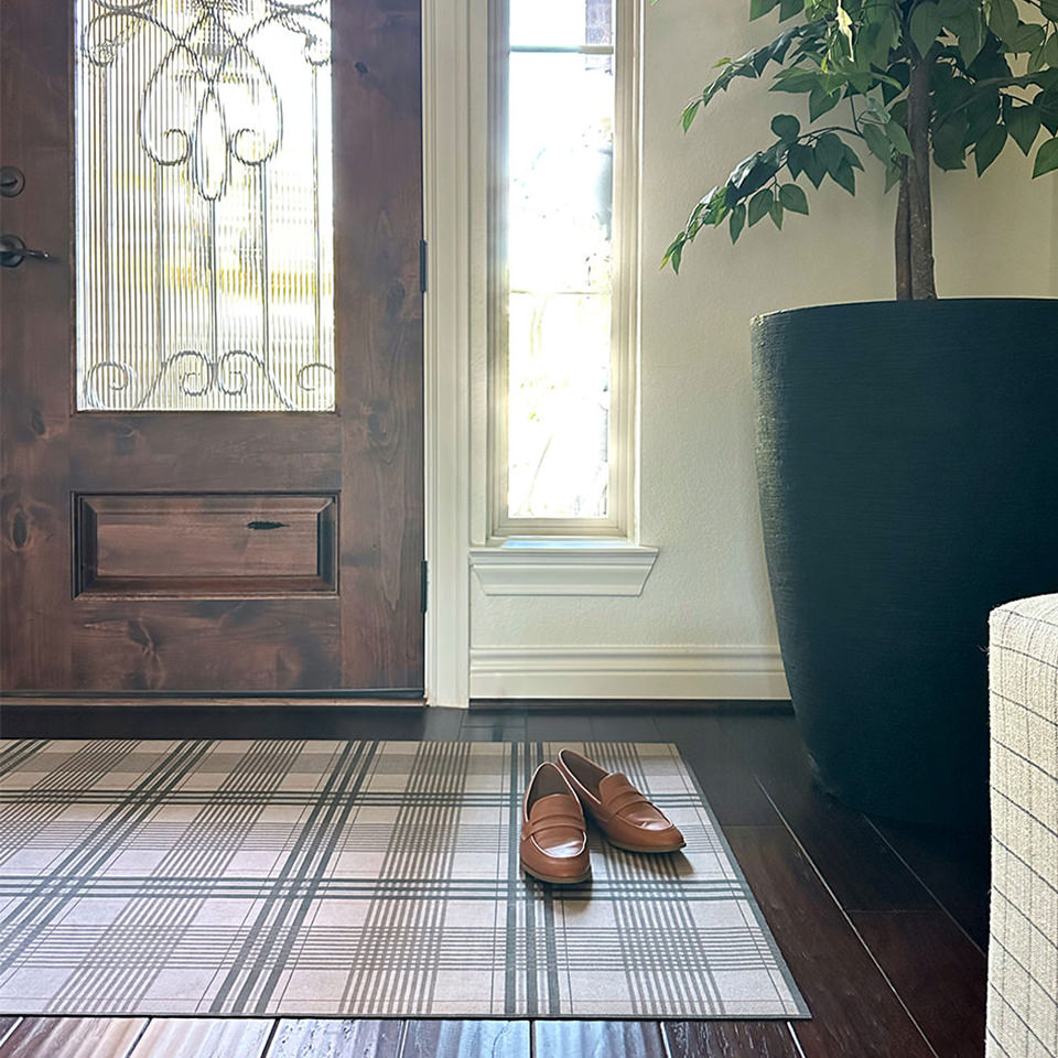 Un-Rug Oxford Plaid front door mat with incredibly low-profile, rubber backed, and machine washable.