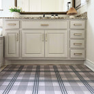 Large Un-Rug Oxford Plaid mat in a bathroom for floor protection and easy-to-clean matting.