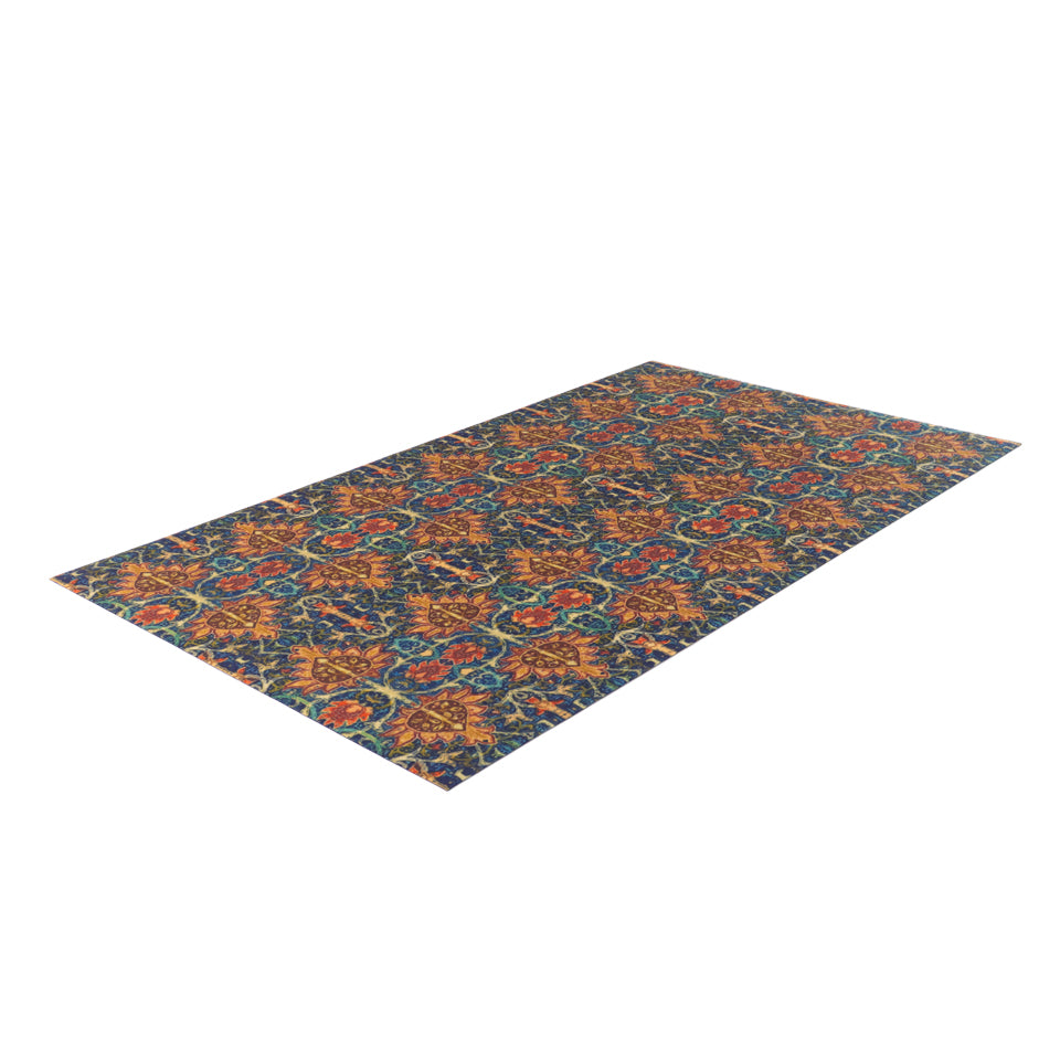 Colorful vibrant Persian style rug with burnt orange, navy, teal, greens, yellows, blues in a repeating ornate pattern on a washable indoor floor mat