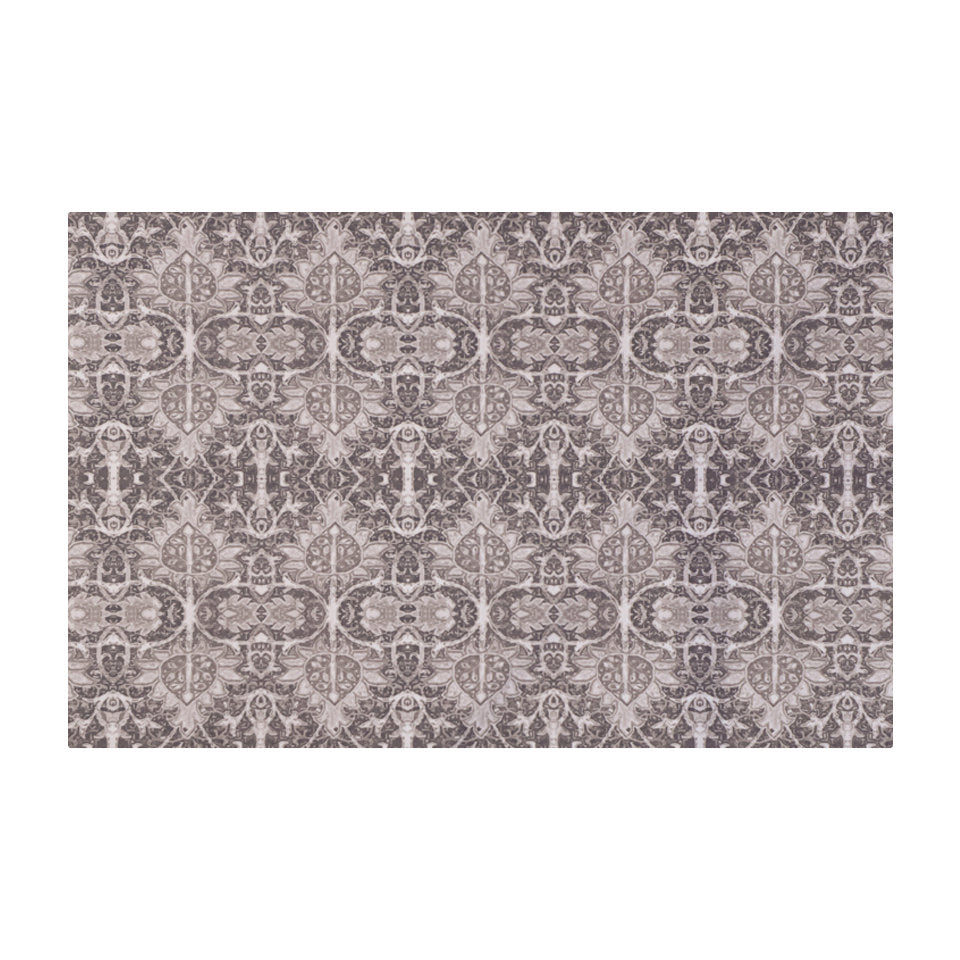 Neutral Persian style rug with greys, tans, and browns in a repeating ornate pattern on a washable indoor mat size small