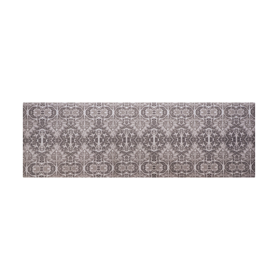 Neutral Persian style rug with greys, tans, and browns in a repeating ornate pattern on a washable indoor floor mat