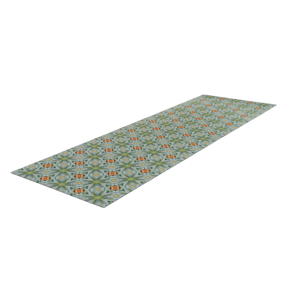 Overhead angled shot of hallway runner sized Neutral kaleidoscope pattern in aquas, apple green, and hints of orange on this low profile washable interior floor mat. 