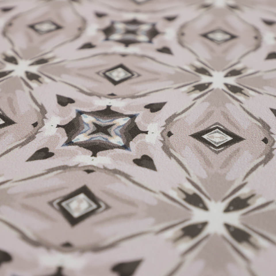 Close up of Neutral kaleidoscope pattern in shiitake tan and urbane bronze brown with touches of storm cloud blue on this low profile washable interior floor mat. 