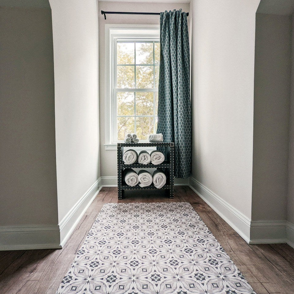 Neutral kaleidoscope pattern in shiitake tan and urbane bronze brown in a bedroom nook protecting the floor