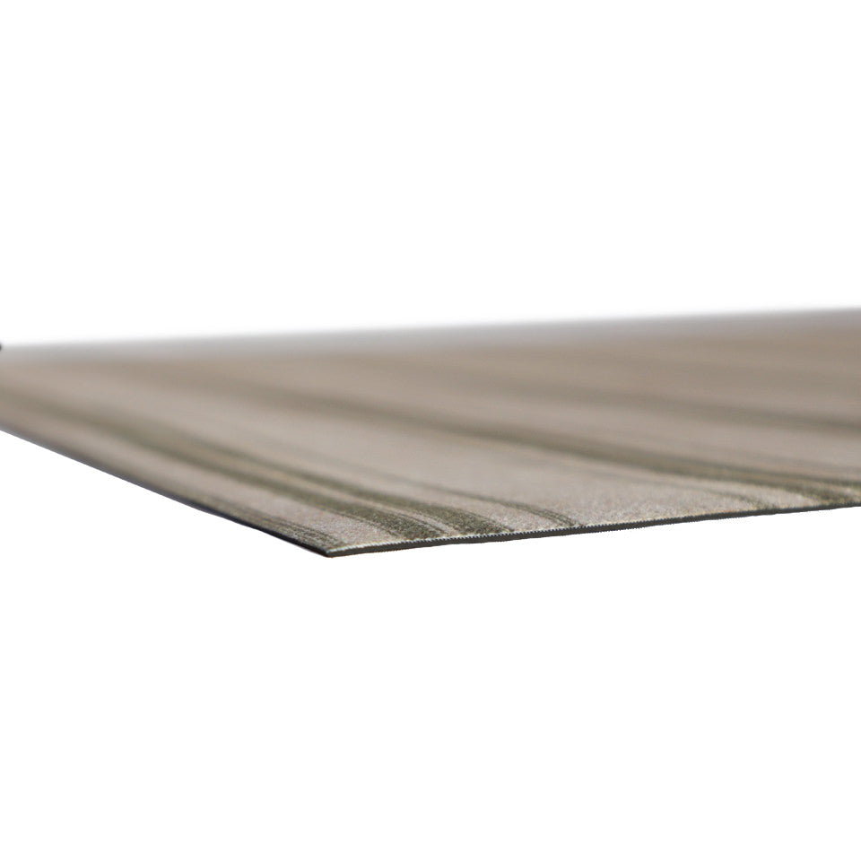 close up corner of extremely thin rubber mat with soft fabric surface