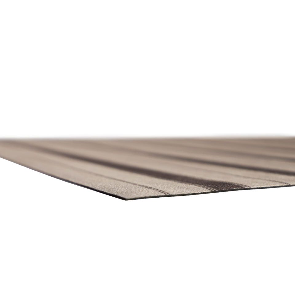 corner of very thin, flat mat with rubber backing and striped fabric surface