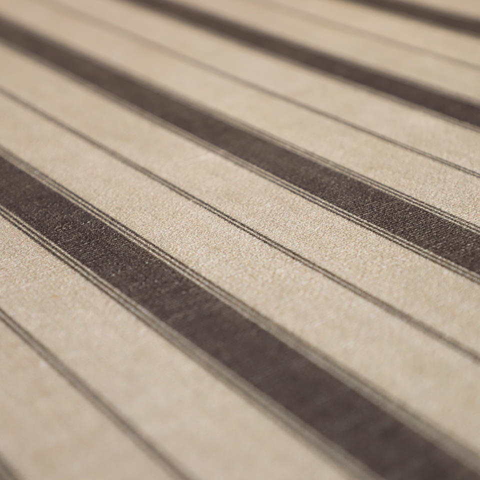 close up of fabric surface with wider stripes and pinstripes in neutral tones