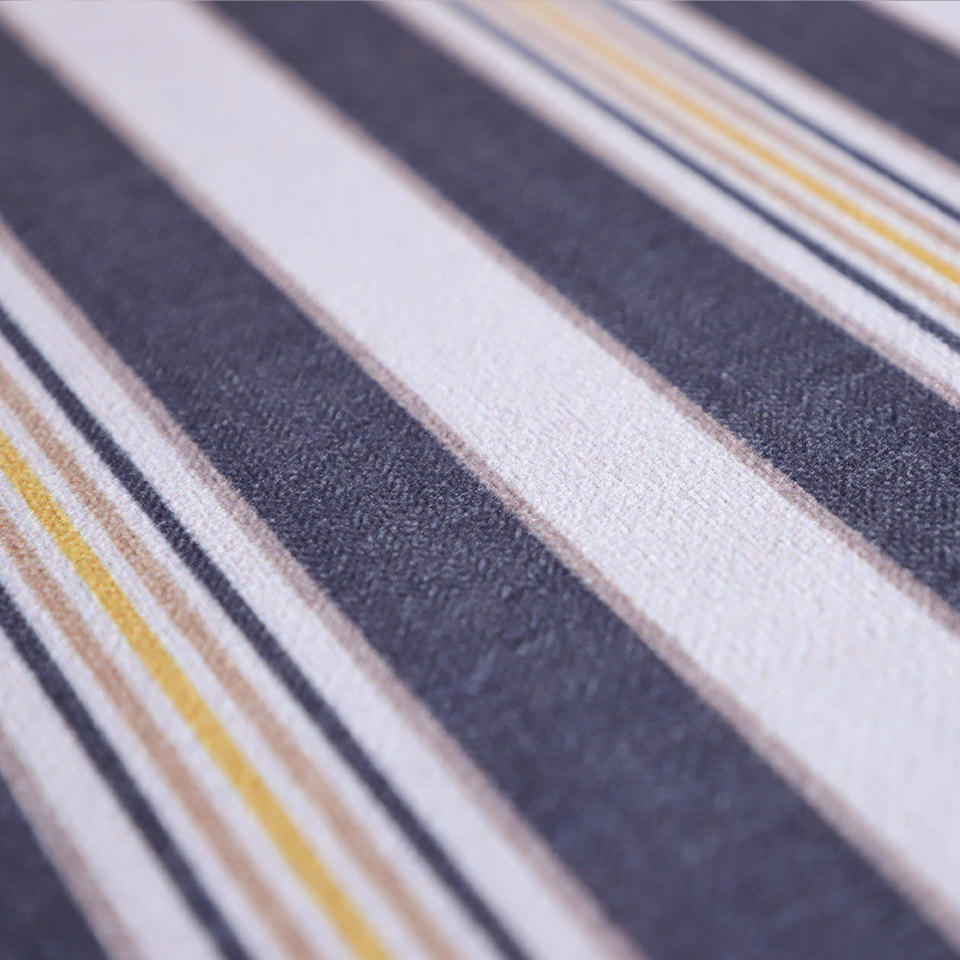 close up of soft knitted fabric with multi stripes in rock bottom, and tassel