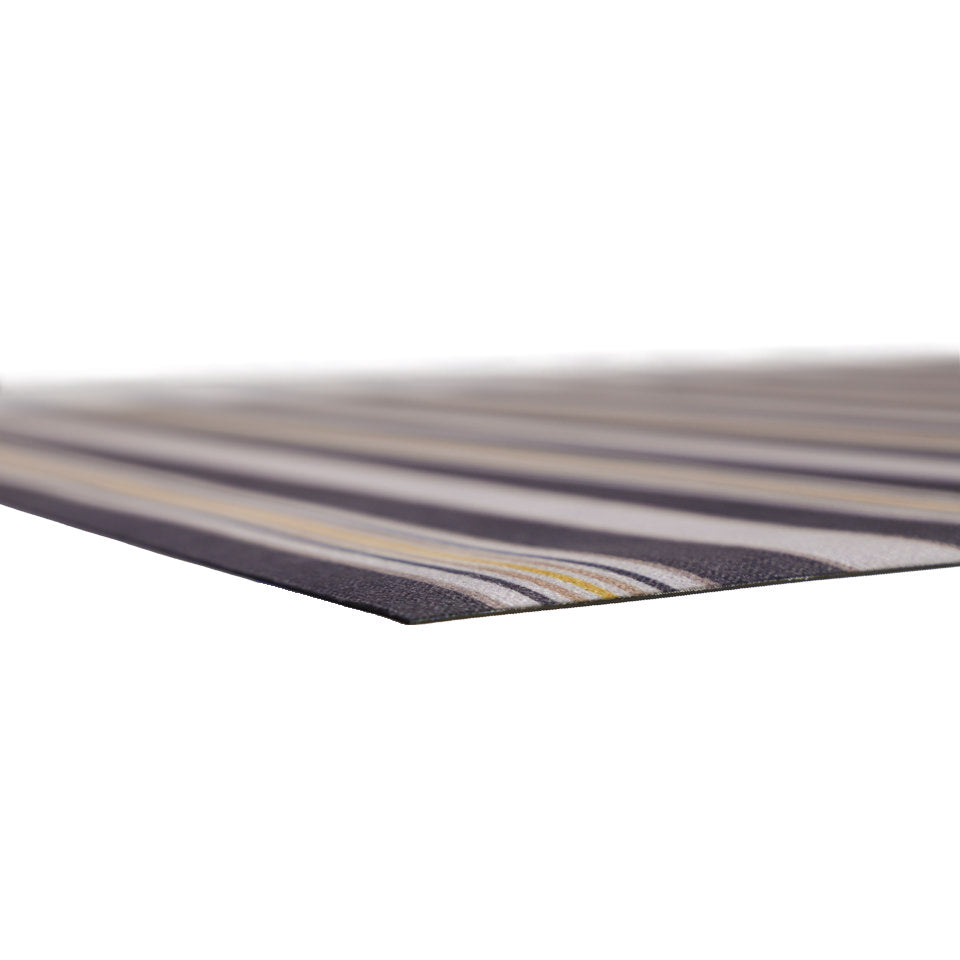 close up corner of very thin, flat, low-profile mat with rubber backing and soft knitted surface