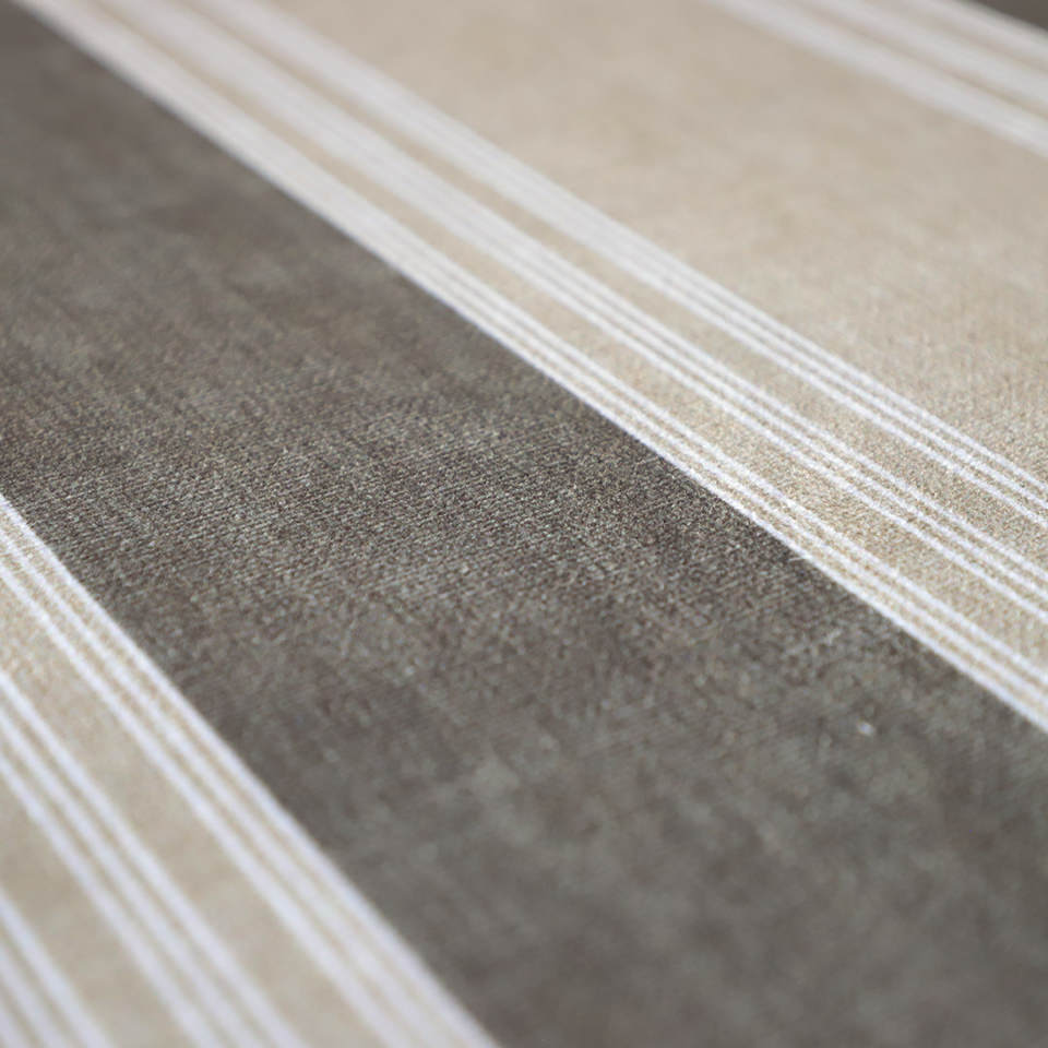 close up of soft fabric surface with grey and beige stripes and white pinstripes