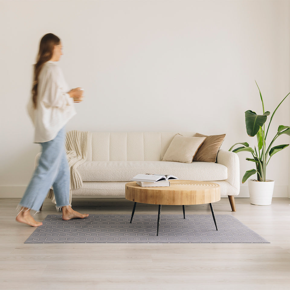 A low-profile Un-Rug in the Timeless Trellis design located in a living room.