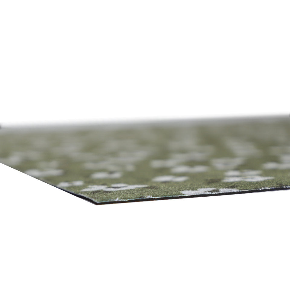 close-up of very thin, low-profile mat in green tiny flowers design