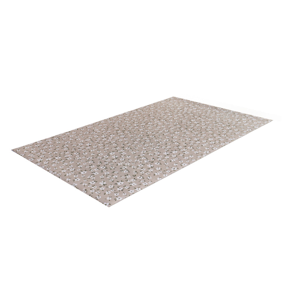 extremely low profile mat in color shiitake (light neutral tone) with small white flowers