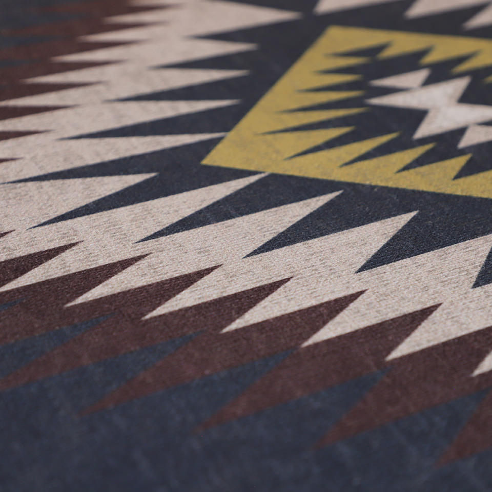 close up image of turkish design pattern with colors dark blue, red/brown, beige, and gold