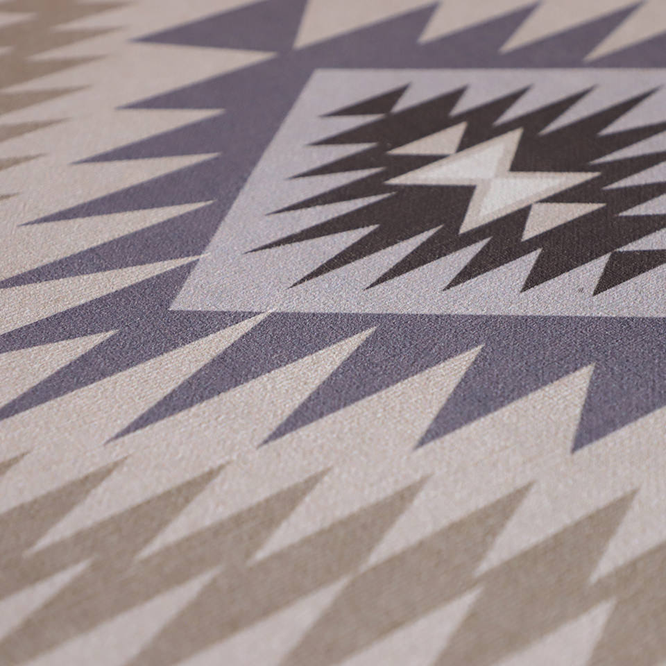 close-up of smooth surface fabric with beautiful turkish pattern in blues, greys, and neutrals