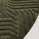 Surface detail image of Heymaker’s bi-level linear design and eco-friendly fabric construction in olive.