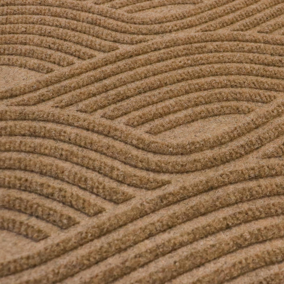 Close-up image of Waves’ bi-level non-shedding surface material in wheat.