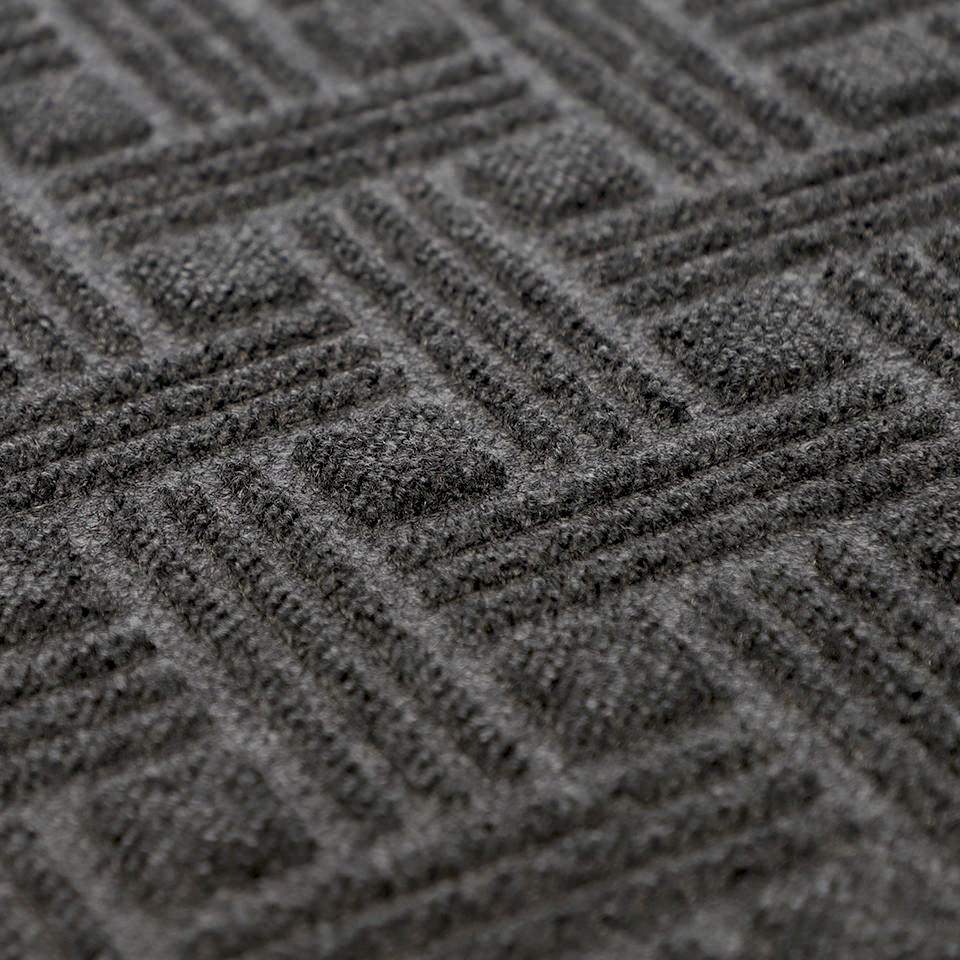Close up of WaterHog Luxe Classic Thatch surface in graphite (dark grey) showing grooves of surface featuring recycled PET fibers.