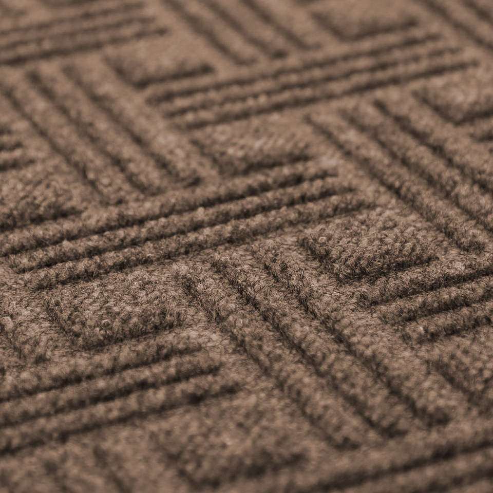 Closeup of WaterHog Luxe Classic Thatch textured surface featuring recycled PET fibers.