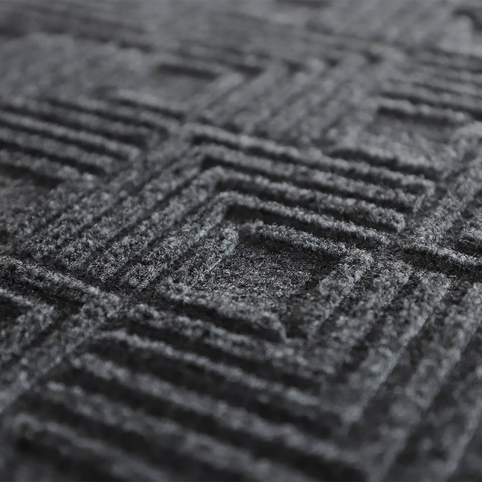 Up close, detailed image of Labyrinth’s surface, capturing the complex linear design carved out by the bi-level surface,, shown in graphite.