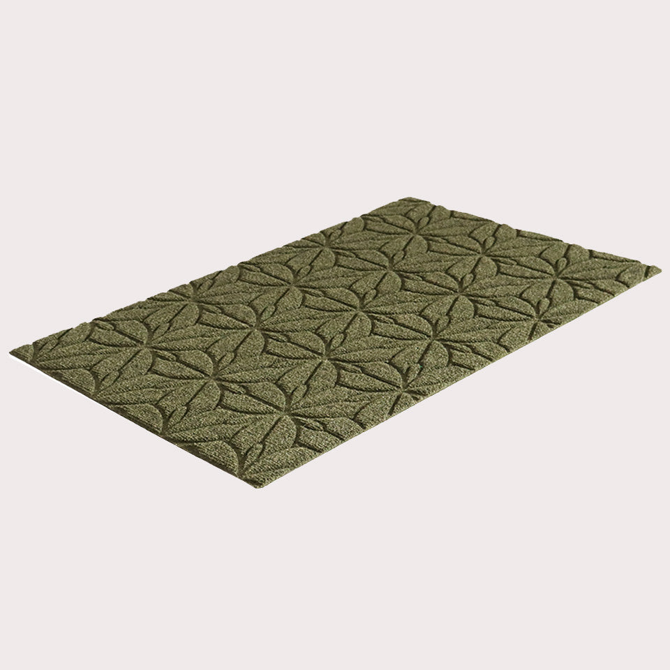 Angled image of the single-door Magnolia mat in the color olive on a creamy white background. 