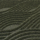 Close-up image of Waves’ bi-level non-shedding surface material in olive.