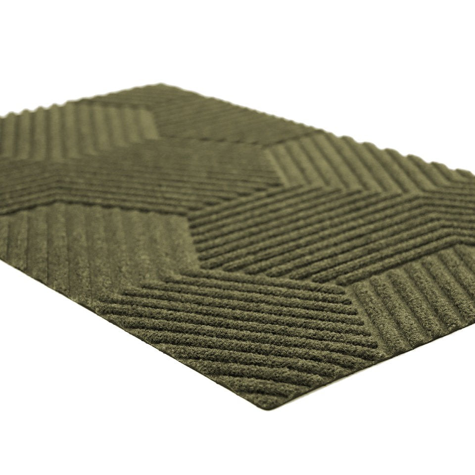 Angle shot of zephyr olive green geometric pattern non-shedding doormat