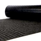 Zephyr geometric doormat with recycled rubber back showing.  Our rubber backs help prevent slips