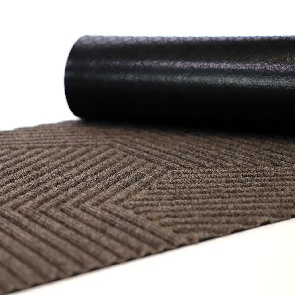 Greige zephyr doormat with rubber backing showing.  Our recycled rubber backing helps prevent slips and trips