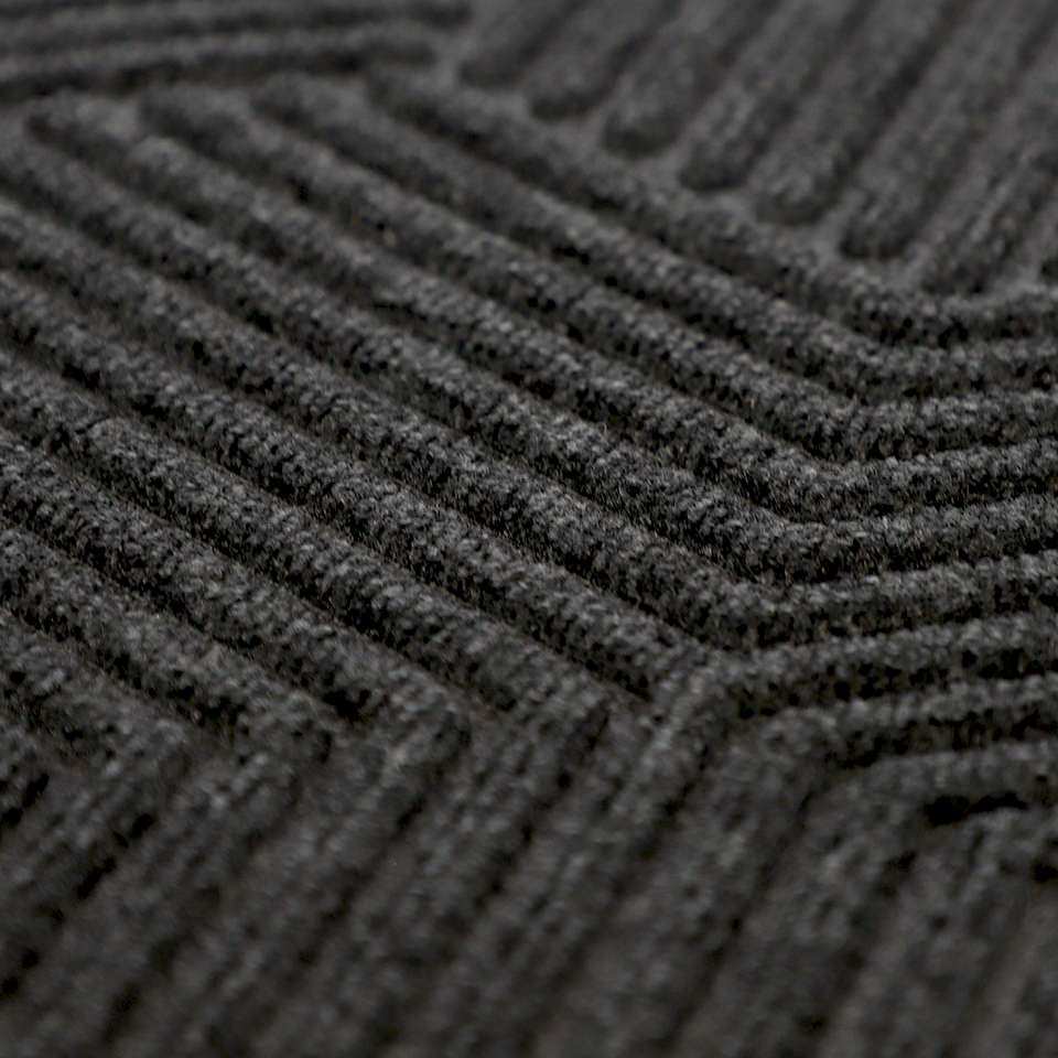 Close up of Zephyr geometric pattern doormat in graphite grey