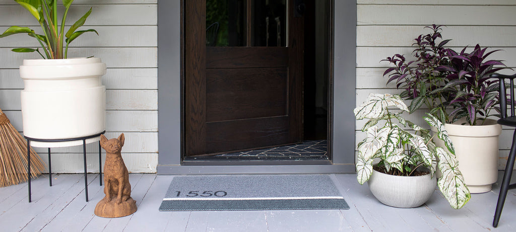 Personalized doormat with house number at front door