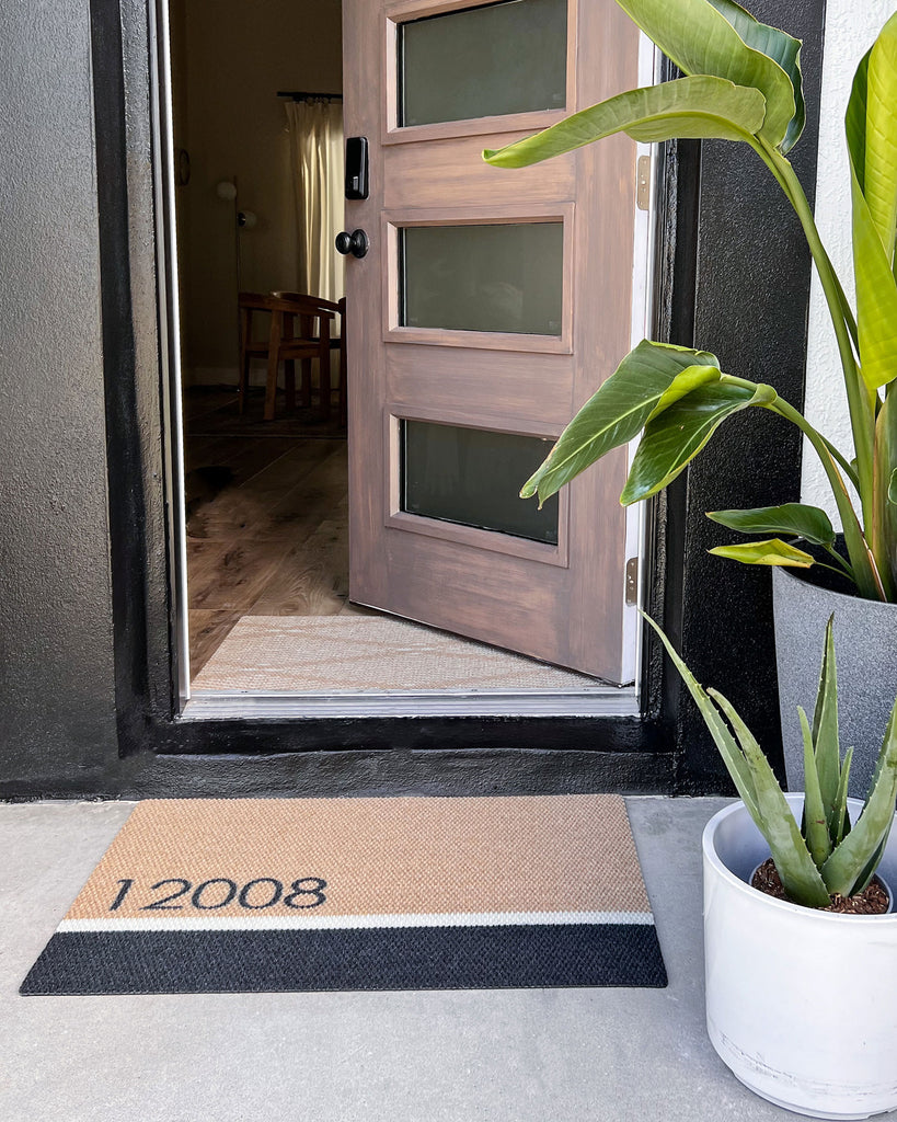 Personalized house number doormat at front door