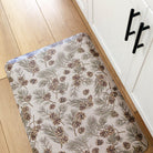 Pinecone fall anti-fatigue kitchen mat top view with wipeable surface and festive holiday design for kitchen comfort