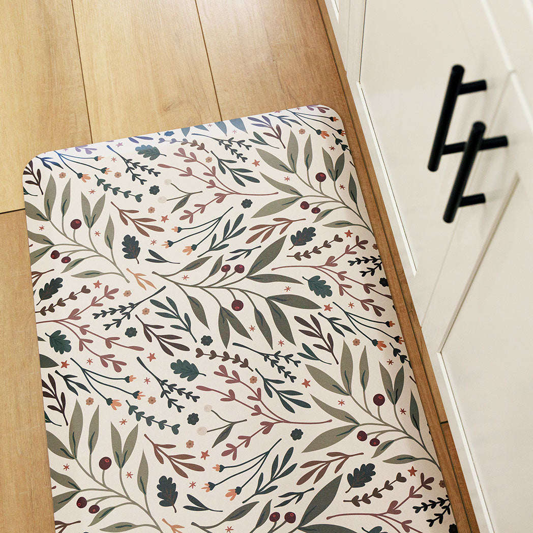 Sprig & Berry foliage Christmas anti-fatigue kitchen mat with wipeable surface and winter holiday design for kitchen comfort.