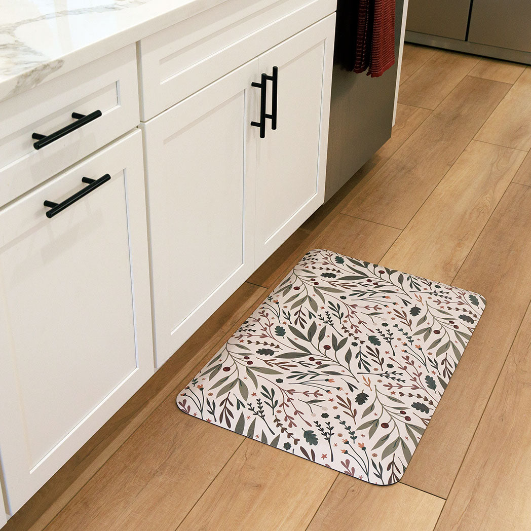 Sprig & Berry foliage Christmas anti-fatigue kitchen mat with wipeable surface and winter holiday design for kitchen comfort.