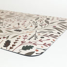 Corner view Sprig & Berry foliage Christmas anti-fatigue kitchen mat with wipeable surface and winter holiday design for kitchen comfort.