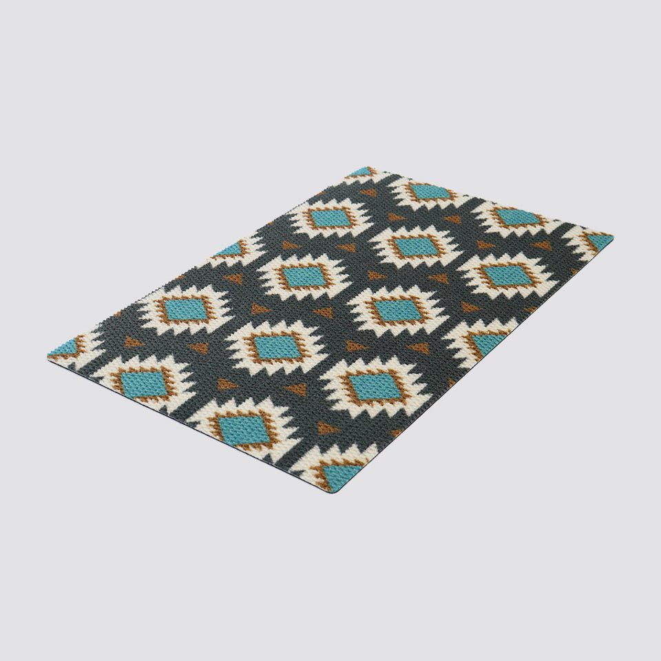 Isolated image of angled Aztec mat in grey and teal