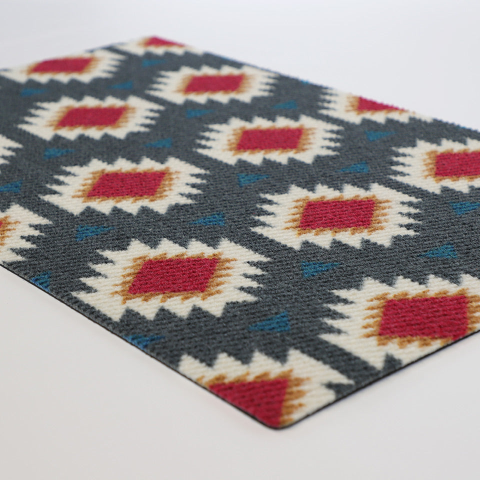 close up image of Aztez single doormat in gray and berry