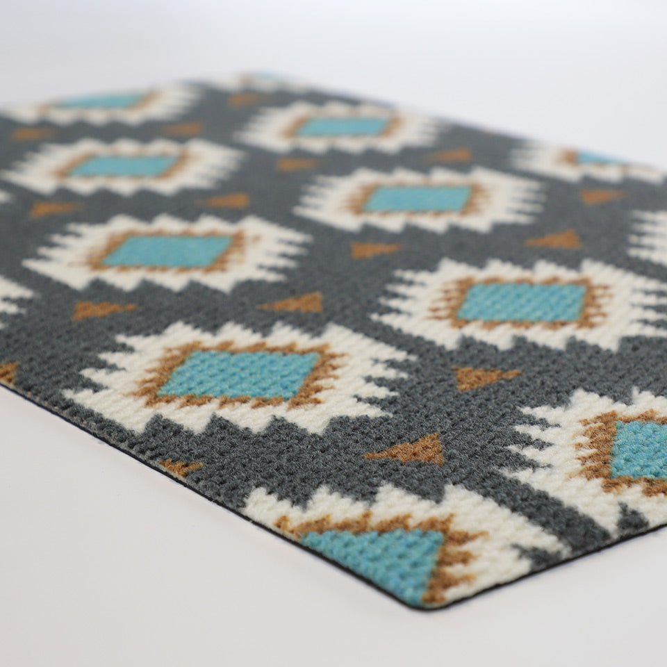 close up of aztec mat on white background from corner angle