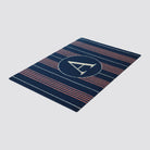 Navy and pink vertical stripes on a basic stripe doormat with monogram A