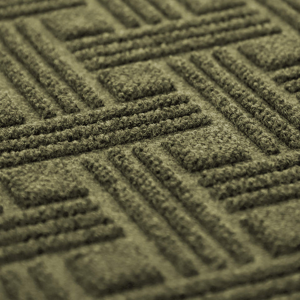 closeup of WaterHog Luxe classic thatch geometric surface in olive