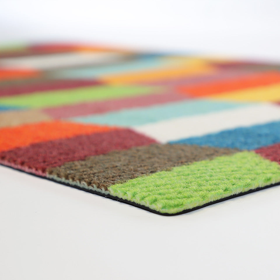 close up of colorful tulips mat laying on flat surface showing thickness of mat