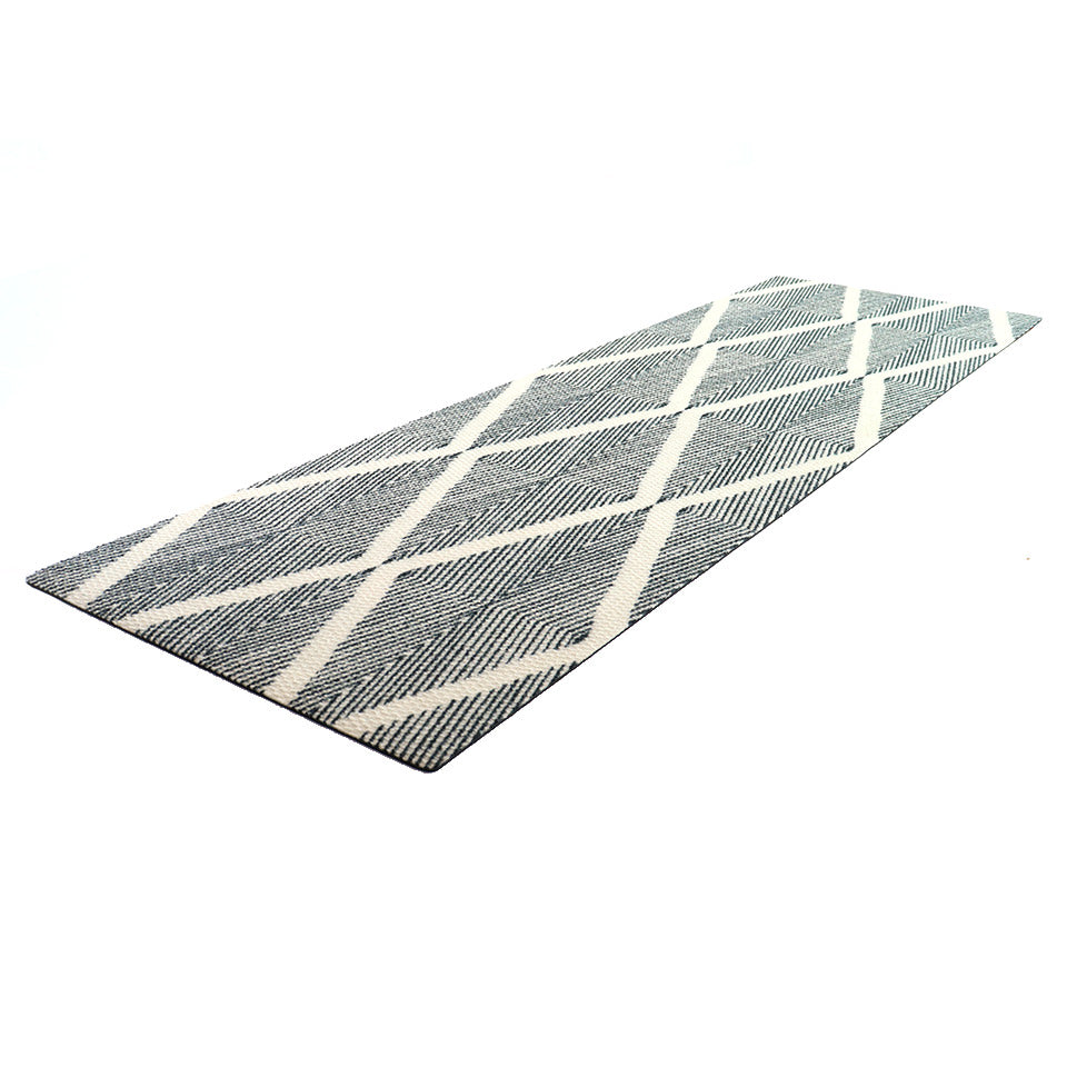 Stylish black and white doormat in a diamond geometric pattern.